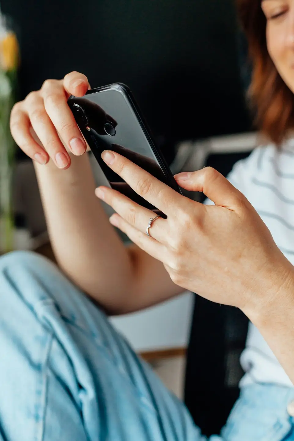 a close up of a person holding a cell phone